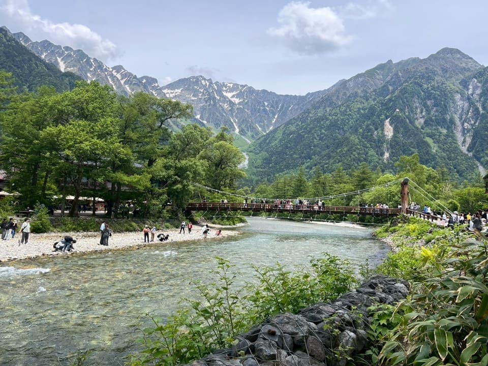 Kappa Bridge in Kamikochi with the snow-streaked Hotaka range